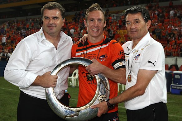Angie Postecoglou, captain Matt Smith and Rudo Vidusic with the 2012 A-League Grand Final trophy.