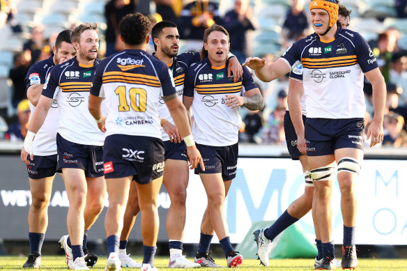 Corey Toole is congratulated by Brumbies teammates after scoring yet another try.