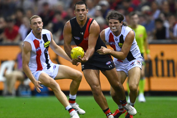 Alec Waterman gets a handball away.