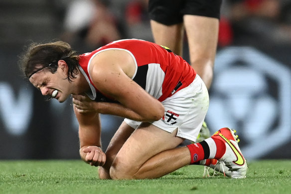 Hunter Clark winces in pain during the AAMI Community series match between St Kilda and Essendon. 