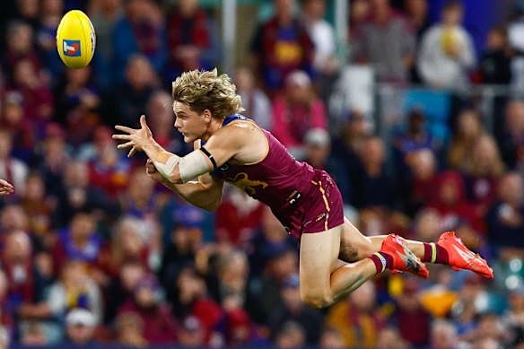 Will Ashcroft fires off a handball.