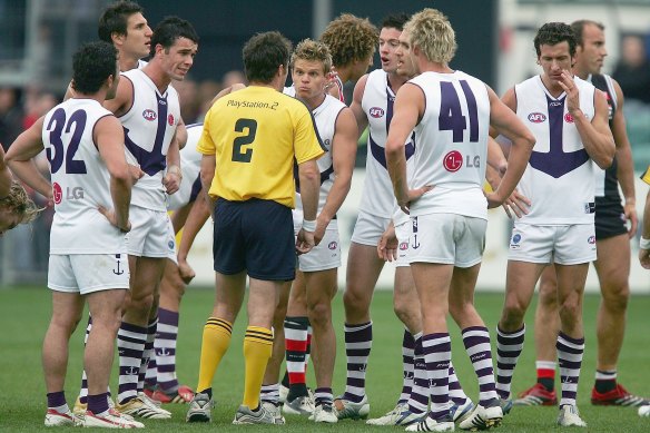 Fremantle players ague with the umpire after not hearing the siren in the round five match against St Kilda in Launceston, 2006.