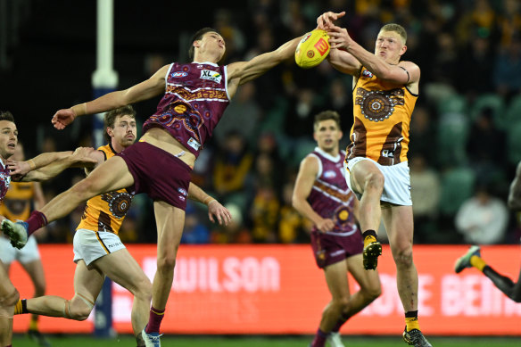Brisbane’s Eric Hipwood and James Sicily fly for the ball.