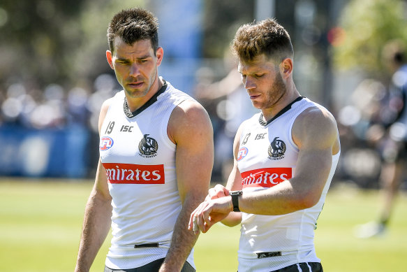 Collingwood's Levi Greenwood (left) with teammate Taylor Adams.