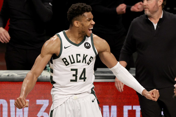 Giannis Antetokounmpo celebrates the Bucks’ win.