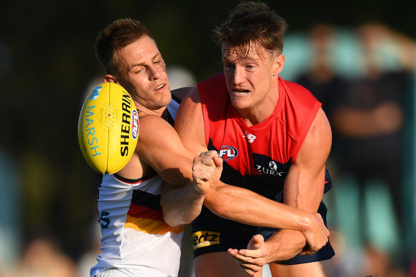 Back in the game: Aaron vandenBerg in action against the Crows at Casey Fields.