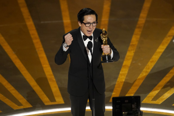 Key Huy Quan accepting the award for best performance by an actor in a supporting role.