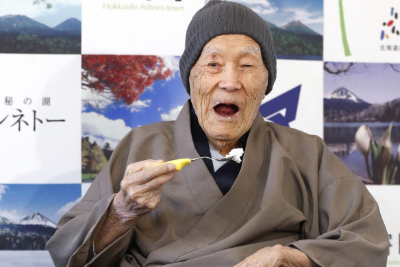Masazo Nonaka of Japan eats cake on April 10, 2018, after the Guinness World Records recognised him as the world’s oldest living man at the  age of 112 years and 259 days.