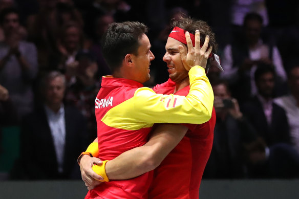 Roberto Bautista Agut and Rafael Nadal celebrate Spain's Davis Cup win.