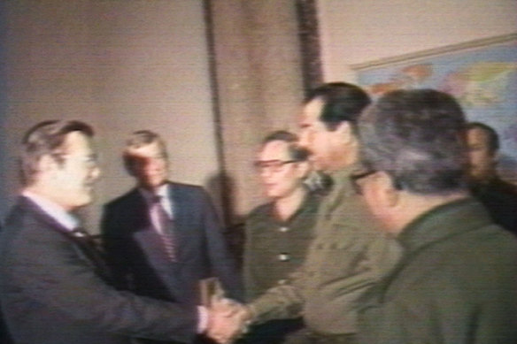An image taken from a video showing Rumsfeld meeting Saddam Hussein while a special envoy to the Middle East.   Nineteen years later Rumsfeld oversaw the invasion of Iraq.