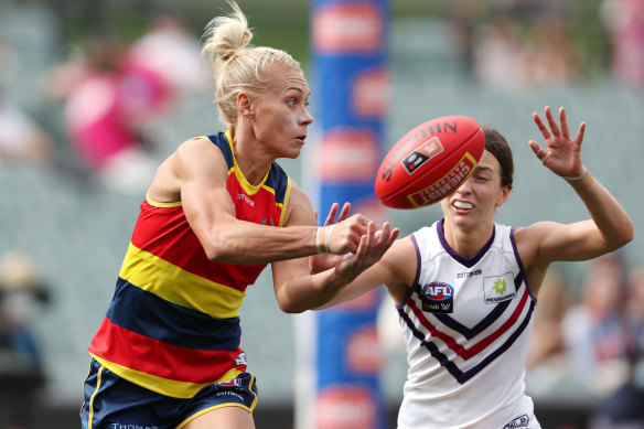 Erin Phillips gets a handball away.