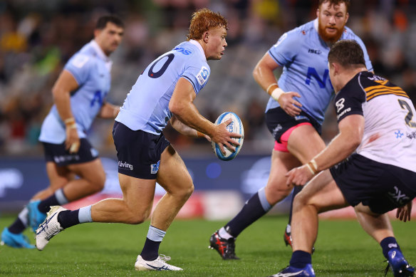  Tane Edmed of the Waratahs runs the ball in Canberra