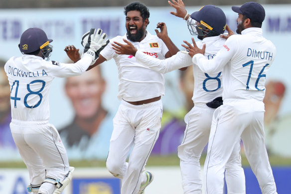 Prabath Jayasuriya celebrates one of his 12 wickets.