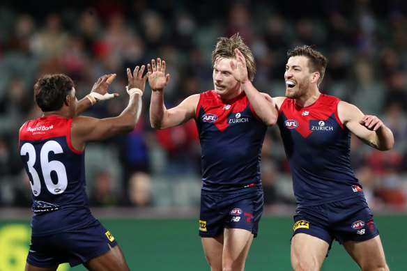 Charlie Spargo celebrates a goal with Kysaiah Pickett and Jack Viney on Saturday.
