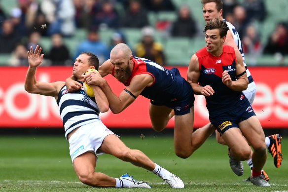 Joel Selwood tackled by Melbourne’s Max Gawn in round 4 in 2021.
