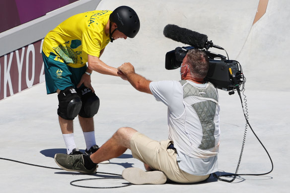 Too close for comfort? Kieran Woolley checks on a TV cameraman he crashed into during the 2020 Olympic qualifiers.