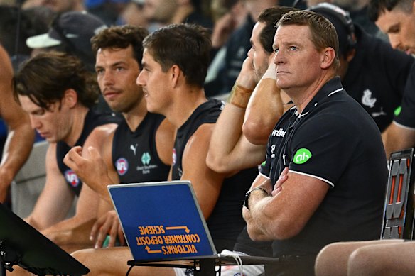 Michael Voss (right) watched his side let another game slip against North Melbourne on Good Friday.