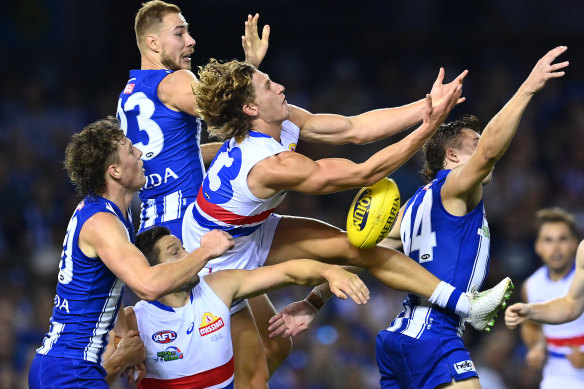 Western Bulldogs forward Aaron Naughton goes for a mark.