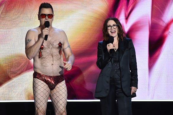 Shirtless, again: Offerman and Mullally at the Independent Spirit Awards in 2022. 
