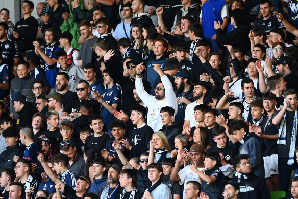 Fans show their support during the round 17 clash at AAMI Park on Saturday night.