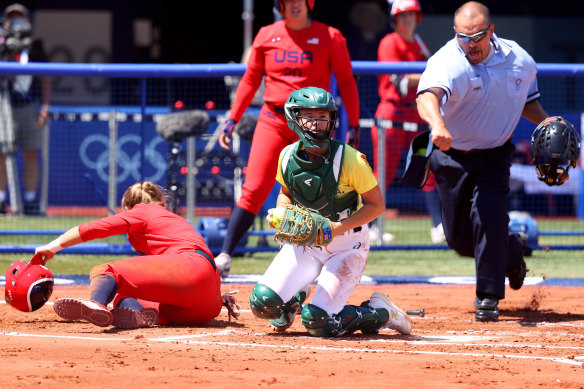 Australian catcher Belinda White successfully tags Haylie McCleney out at the plate.