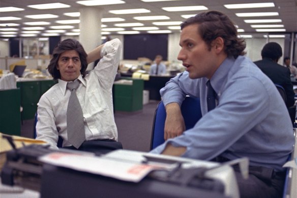 Bob Woodward, right, and Carl Bernstein, sit in the newsroom of the Washington Post, on May 7, 1973. 