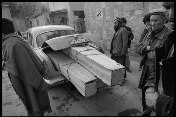 Taxi delivering coffins, Jamhuriat Hospital, Kabul, 1993.