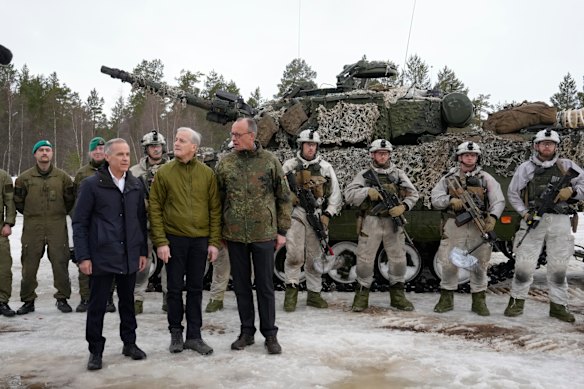 Canadian Prime Minister Mark Carney, Norwegian Prime Minister Jonas Gahr Støre and German Chancellor Friedrich Merz tour the site of NATO Exercise Cold Response in Bardufoss, Norway.