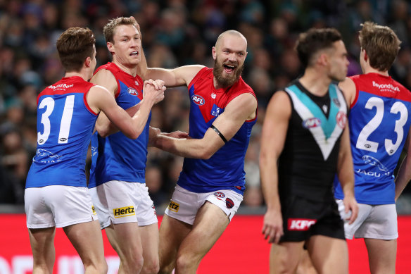 Tom McDonald (left) and Max Gawn (right) celebrate a goal.