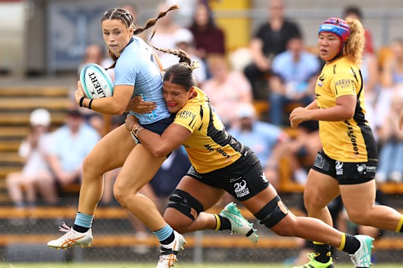 Desi Miller carrying the ball for the Waratahs.