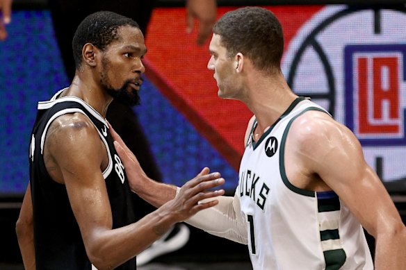Kevin Durant and Brook Lopez share a moment after the game.