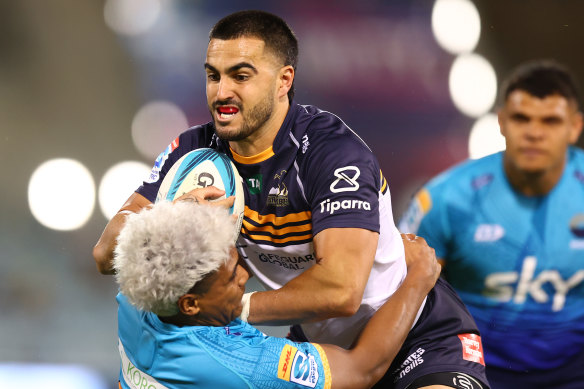 The Brumbies’ Tom Wright takes on the defence against Moana Pasifika.