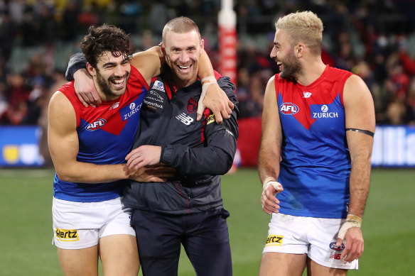 Christian Petracca, Simon Goodwin and Christian Salem celebrate a win this season.