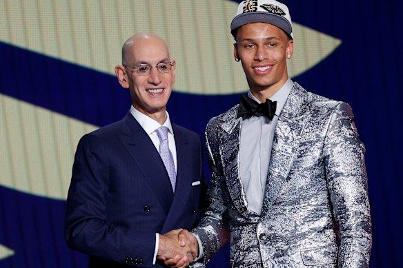Dyson Daniels is congratulated by NBA commissioner Adam Silver after being selected at pick eight in the 2022 NBA draft.