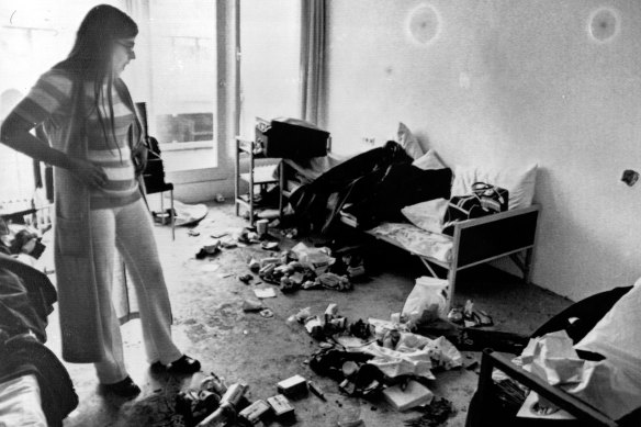 Ankie Spitzer, widow of the Israeli fencing coach, Andre Spitzer, who was slain by Arab terrorists, surveys the room where the incident occurred at Munich’s Olympic Village.