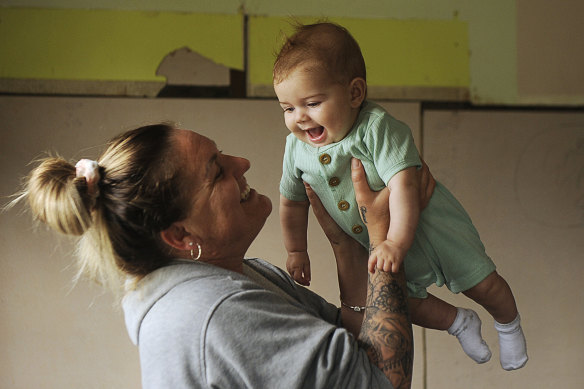 Jahnaya Mumford with her eight-month-old son Harlem, who was born a week after the flood.