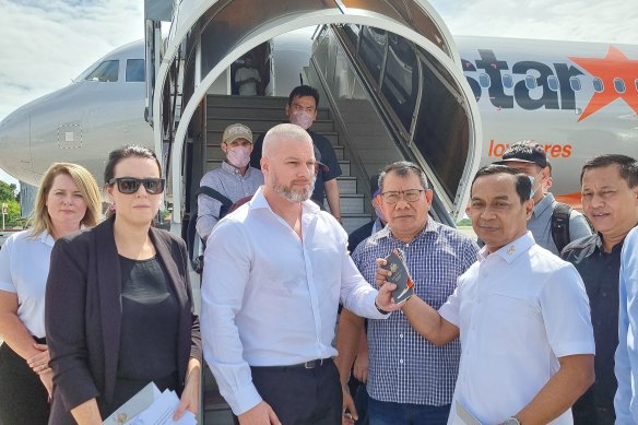 Australian and Indonesian officials at the airport before the remaining Bali Nine members were flown home.