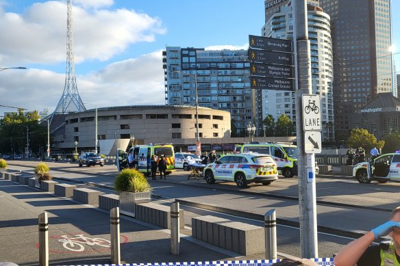 Police attend an incident on Princes Bridge on Friday.
