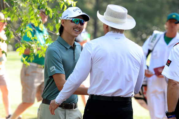 Greg Norman chats with fellow Australian Min Woo Lee at Augusta.