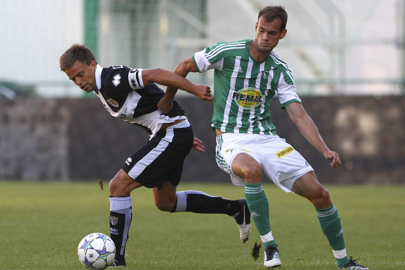 Daniele Galloppa of FC Parma competes for the ball with Martin Jirous of Bohemians 1905.