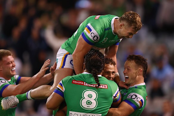 The Raiders celebrate their late winning try against the Sharks.