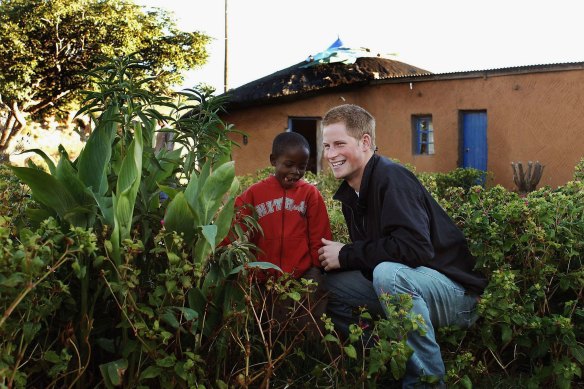 Prince Harry and Mutsu Potsane inspect the Peach Tree that they planted in 2004, in the grounds of the Mants’ase children’s home while on a return visit to Lesotho in 2006.