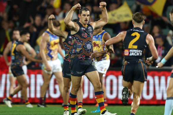 Taylor Walker celebrates one of his three goals.