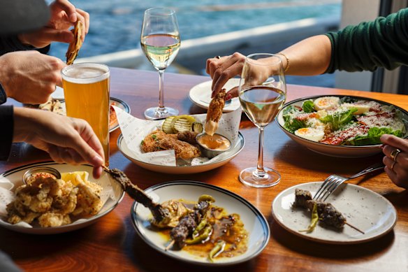 Chicken wings, calamari and Caesar salad at The Oriana pub. 