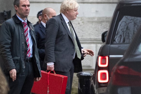 Prime Minister Boris Johnson leaves Downing Street in London on Friday. 