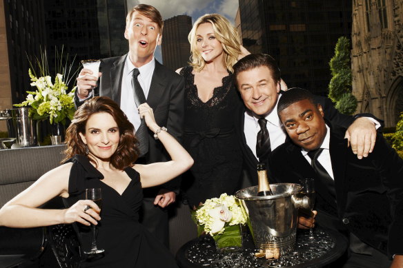 The cast of 30 Rock (from left): Tina Fey, Jack McBrayer, Jane Krakowski, Alec Baldwin and Tracy Morgan. 