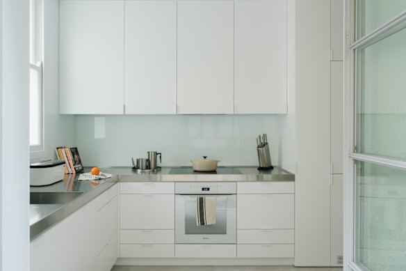 The crisp contemporary kitchen replaced the scullery.