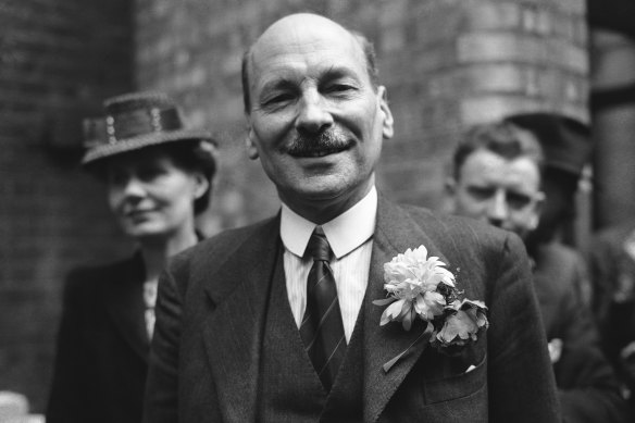 Britain’s postwar PM Clement Attlee smiles at a cheering crowd in London in July 1945.