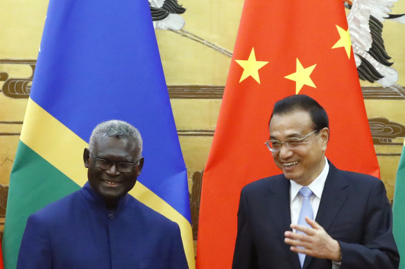 Solomon Islands Prime Minister Manasseh Sogavare with Chinese Premier Li Keqiang in Beijing in October 2019.