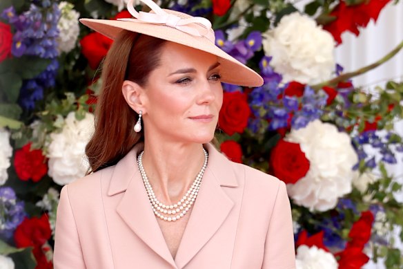 Princess Catherine in Dior greeting French President Emmanuel Macron and his wife Brigitte.
